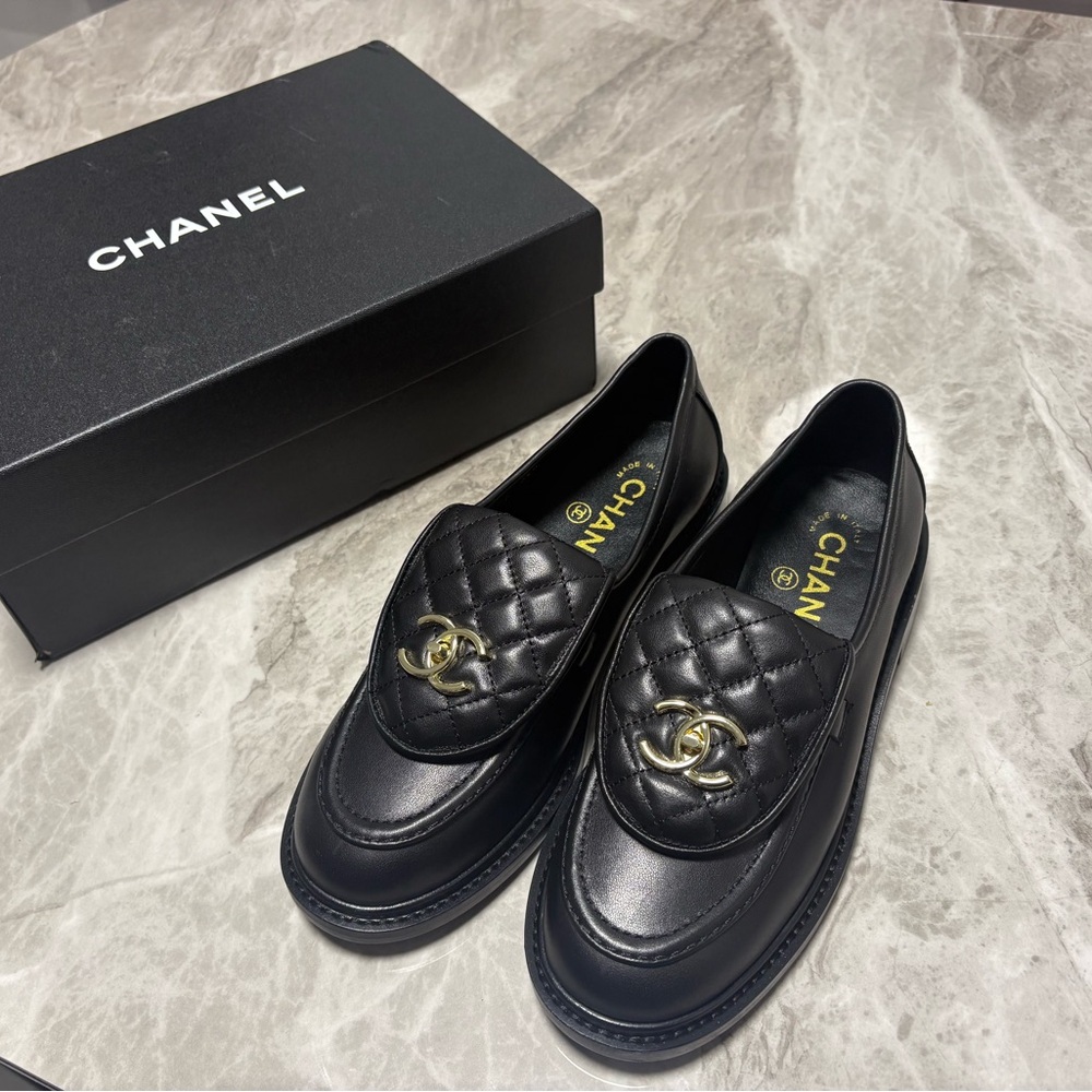 CHANEL Black Quilted Leather Loafers with Gold Accent
